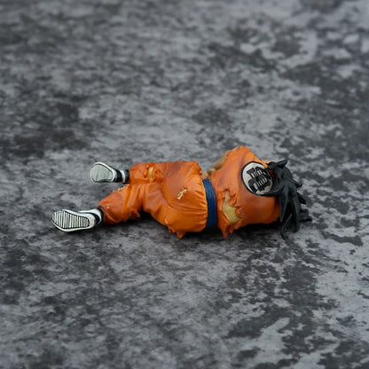 Figura de Yamcha Derrotado en el Suelo